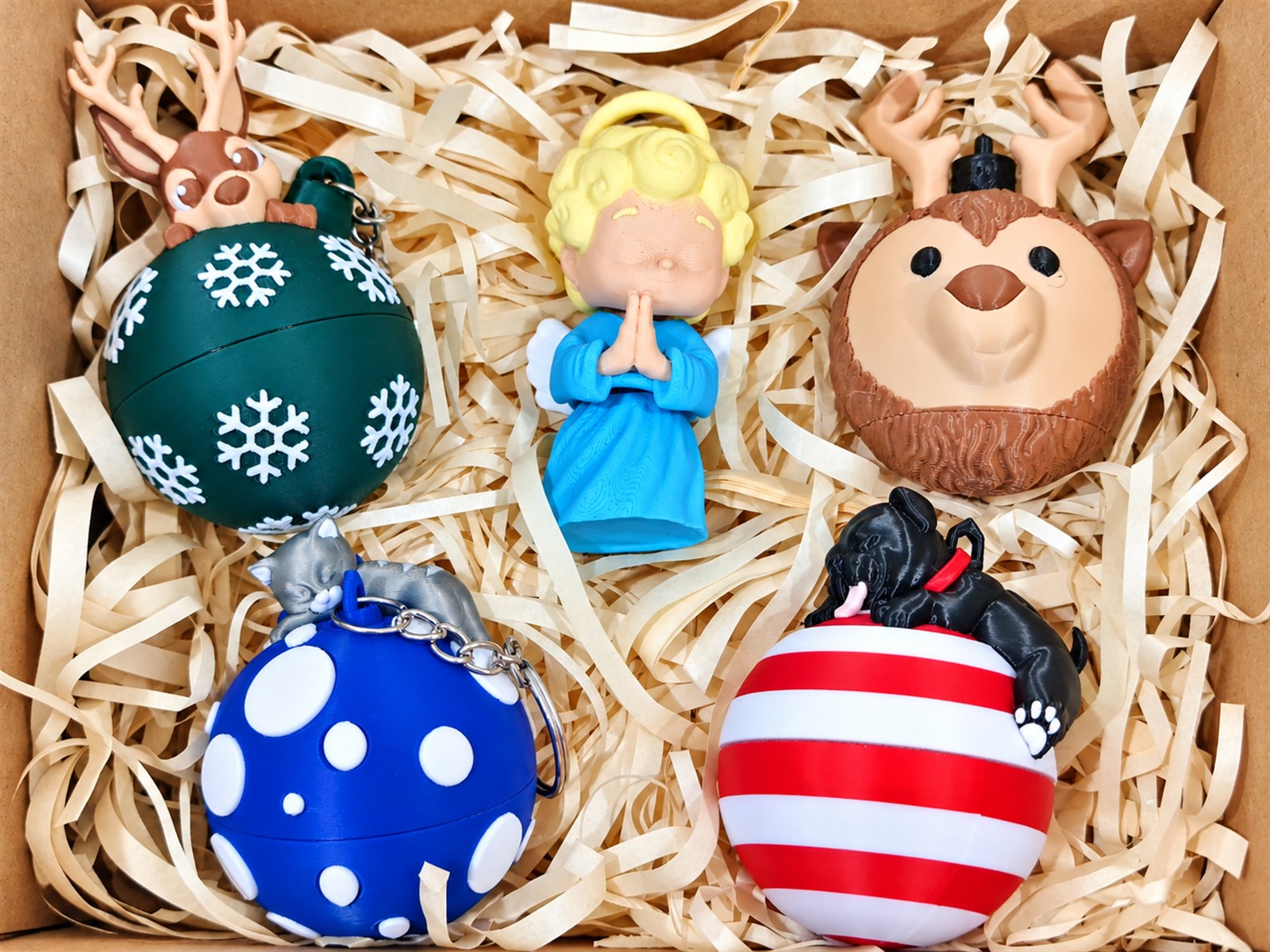 Boxed set of custom PLA holiday ornaments and character pieces for employees