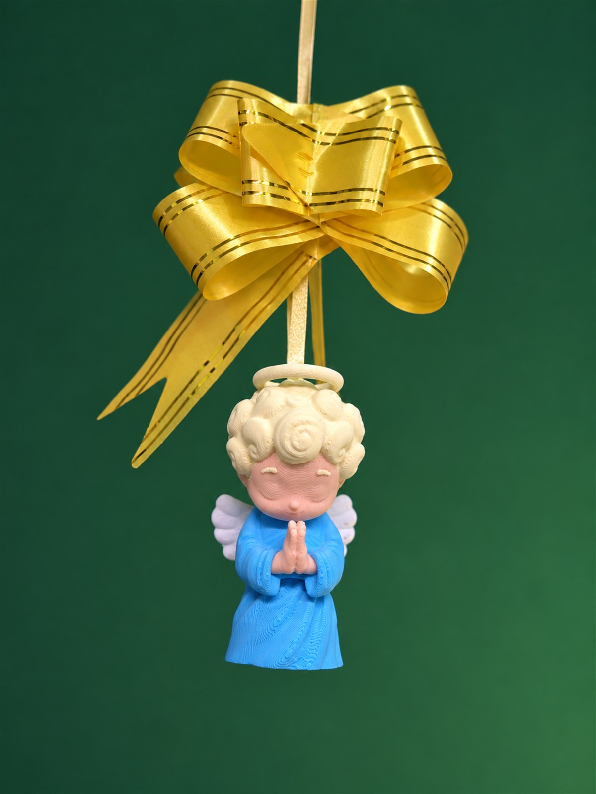 Custom 3D printed PLA angel ornament from a holiday employee gift set